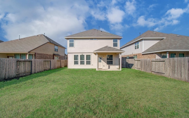 back of property featuring a patio and a yard