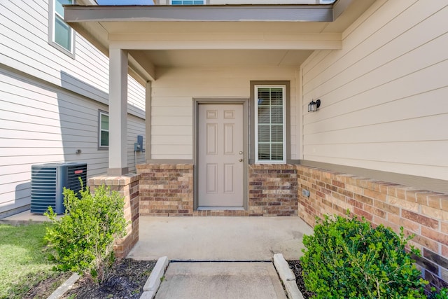 doorway to property featuring cooling unit