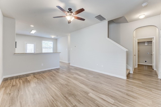 unfurnished room featuring ceiling fan and light hardwood / wood-style flooring