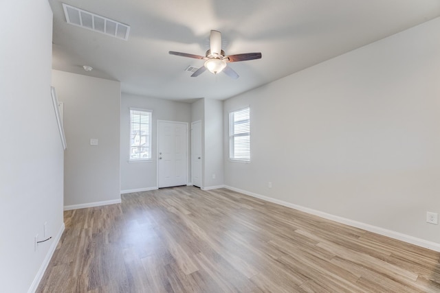 unfurnished room featuring light hardwood / wood-style floors and ceiling fan