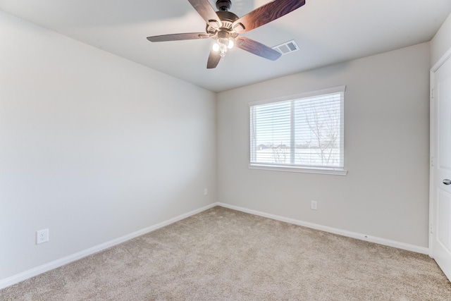 empty room with light carpet and ceiling fan