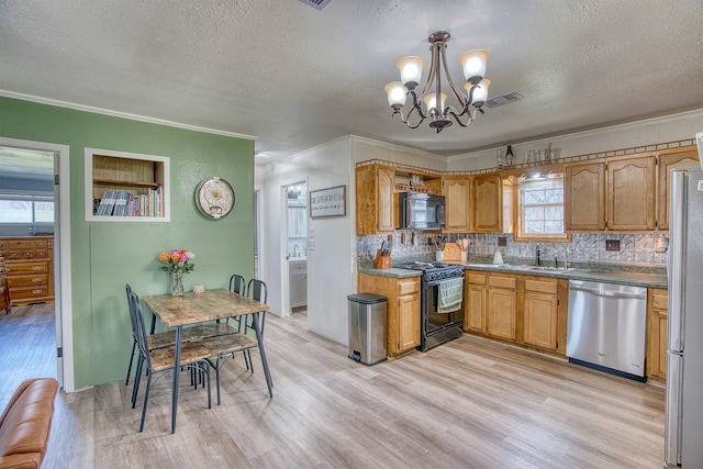 kitchen featuring black appliances, crown molding, and light hardwood / wood-style floors