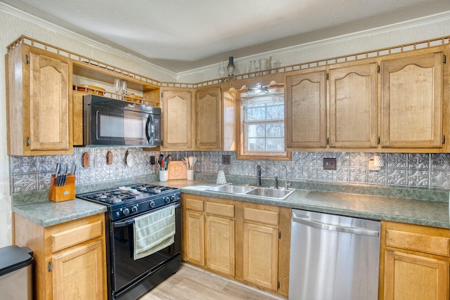 kitchen with ornamental molding, sink, tasteful backsplash, and black appliances