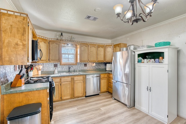 kitchen with light hardwood / wood-style flooring, sink, decorative light fixtures, black appliances, and tasteful backsplash