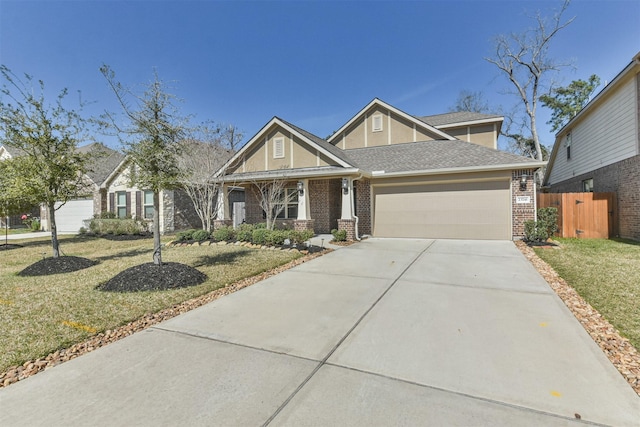 craftsman inspired home with a front lawn and a garage