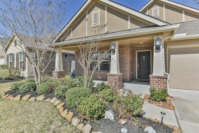 view of front of house featuring a garage and a porch