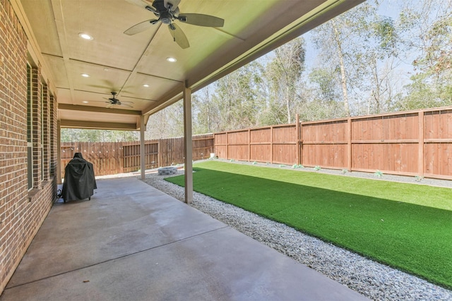 view of patio / terrace featuring a fenced backyard and a ceiling fan