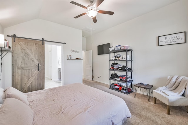 bedroom featuring a barn door, a ceiling fan, vaulted ceiling, and light carpet