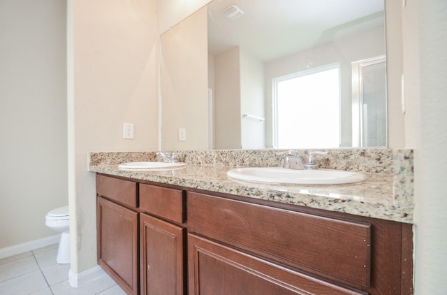 bathroom featuring vanity, toilet, and tile patterned floors