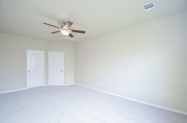 unfurnished bedroom with ceiling fan and carpet