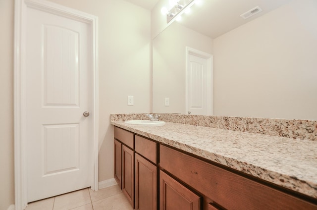 bathroom featuring tile patterned floors and vanity