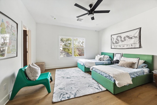 bedroom featuring hardwood / wood-style floors and ceiling fan