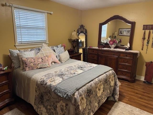 bedroom with hardwood / wood-style flooring