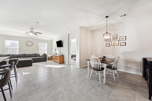 dining room featuring light tile patterned floors, baseboards, and visible vents