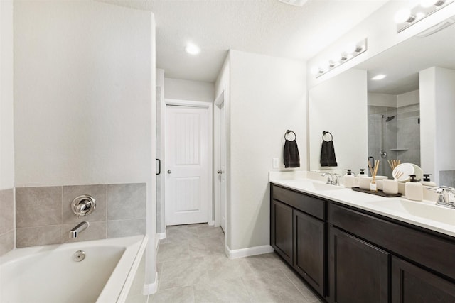 full bath featuring double vanity, a sink, a bath, and a shower stall