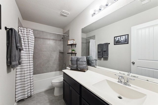 bathroom with toilet, shower / bath combo, vanity, a textured ceiling, and tile patterned floors