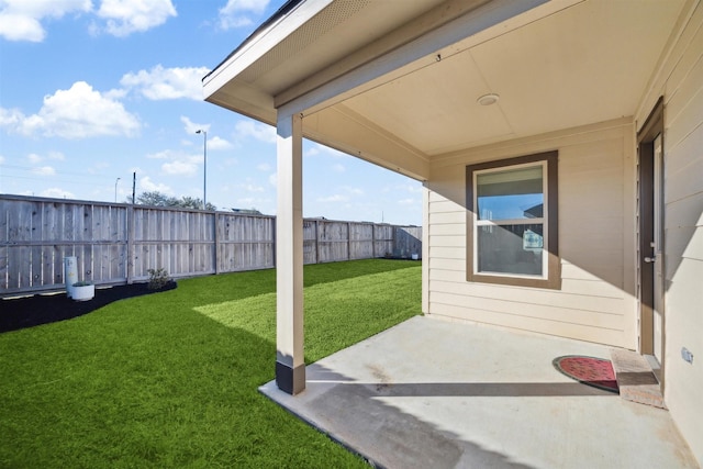 view of yard with a patio area and a fenced backyard