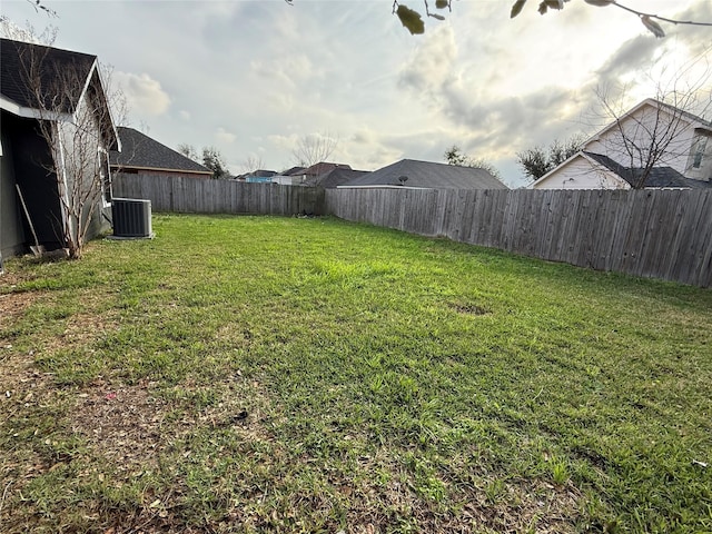 view of yard featuring central air condition unit