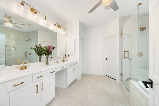 bathroom with ceiling fan, vanity, and walk in shower