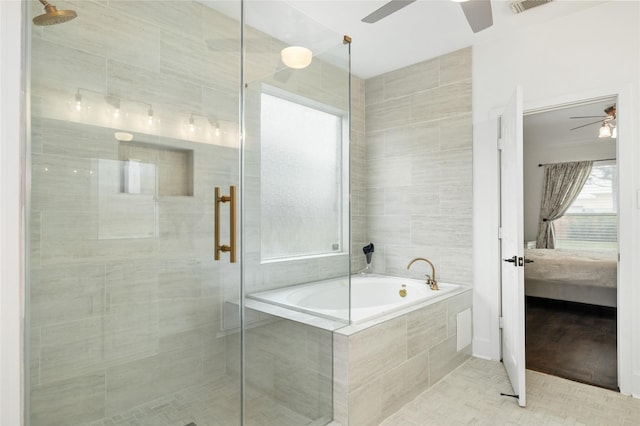 bathroom featuring ceiling fan and plus walk in shower