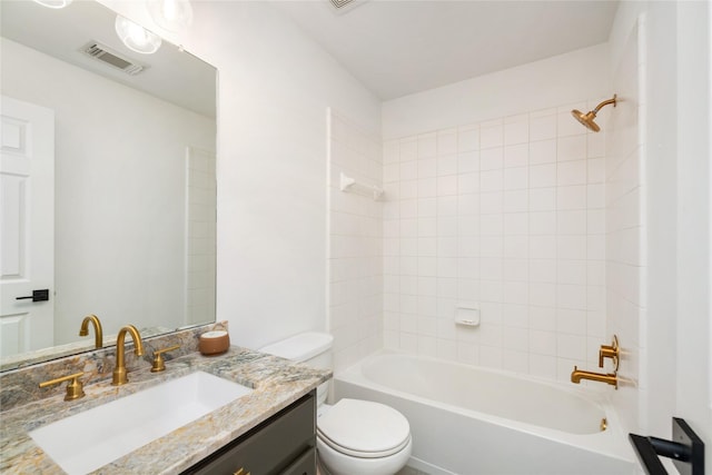 full bathroom featuring vanity, toilet, and tiled shower / bath