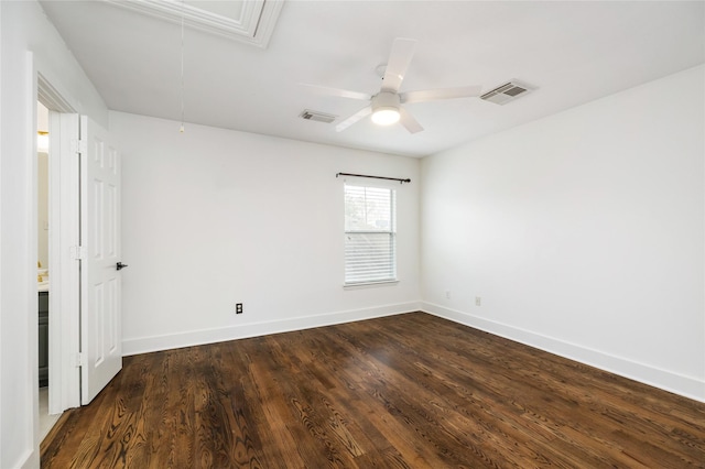 empty room featuring ceiling fan and dark hardwood / wood-style flooring