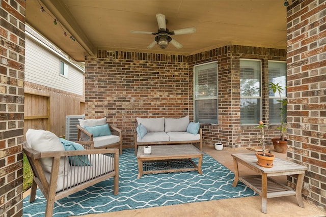 view of patio with an outdoor living space and ceiling fan