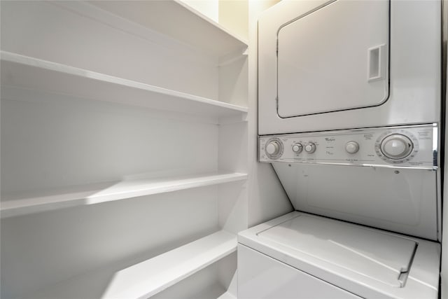 laundry area with stacked washer and clothes dryer