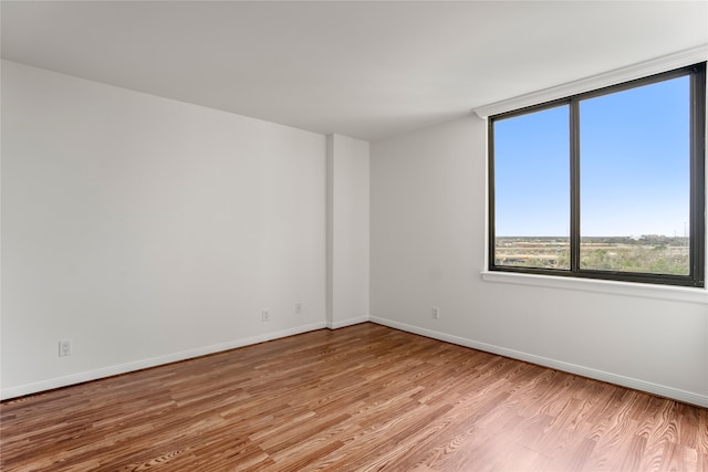 spare room featuring light hardwood / wood-style floors