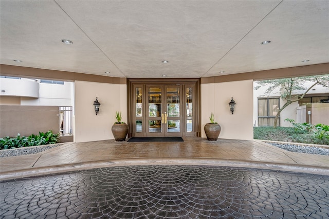 entrance to property featuring french doors