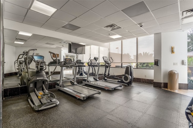 exercise room featuring a drop ceiling