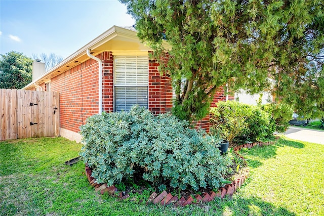 view of property exterior with a yard