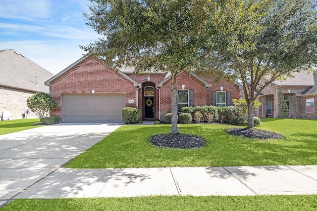 view of front of home featuring a garage, driveway, a front lawn, and brick siding