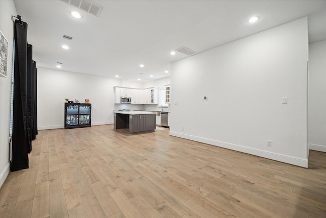 unfurnished living room featuring light hardwood / wood-style flooring