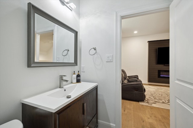 bathroom featuring hardwood / wood-style floors and vanity