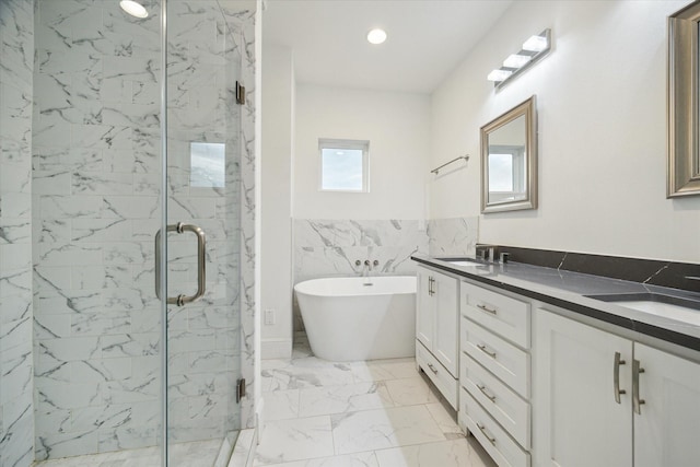 bathroom featuring tile walls, separate shower and tub, and vanity