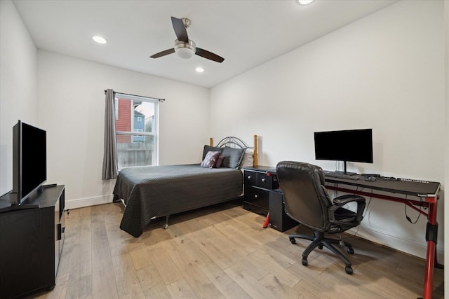 bedroom with ceiling fan and light hardwood / wood-style flooring