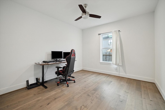 office area with ceiling fan and light hardwood / wood-style flooring