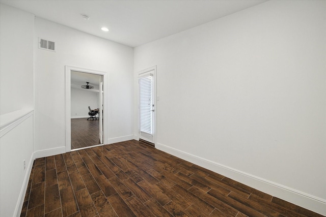 empty room with dark hardwood / wood-style floors