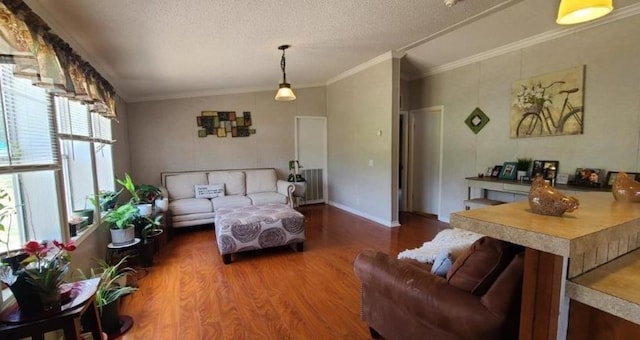 living area featuring a textured ceiling, wood finished floors, baseboards, radiator heating unit, and crown molding