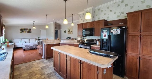 kitchen featuring a center island, light countertops, a peninsula, black appliances, and wallpapered walls