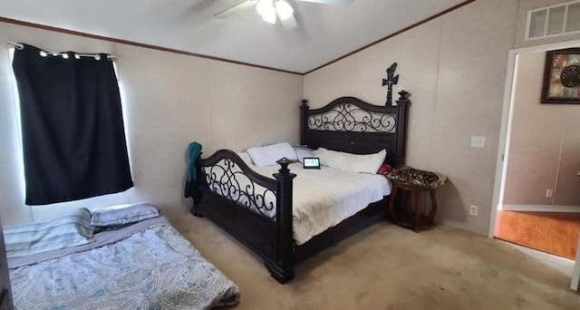 bedroom with ceiling fan, visible vents, and ornamental molding