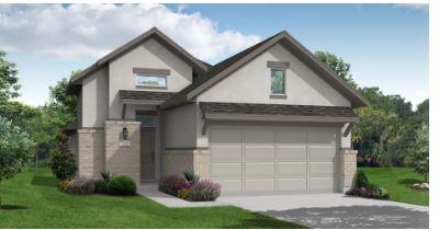 view of front of home featuring a front lawn and a garage