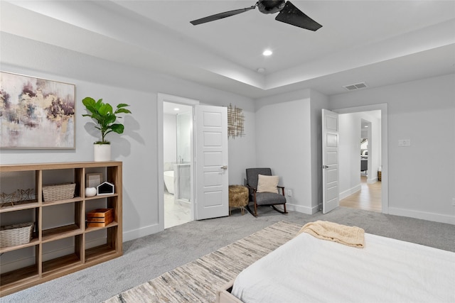 carpeted bedroom featuring ensuite bathroom and ceiling fan