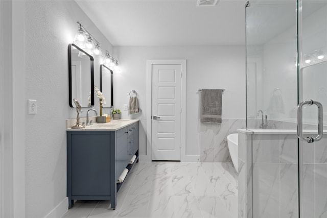 bathroom featuring vanity and shower with separate bathtub