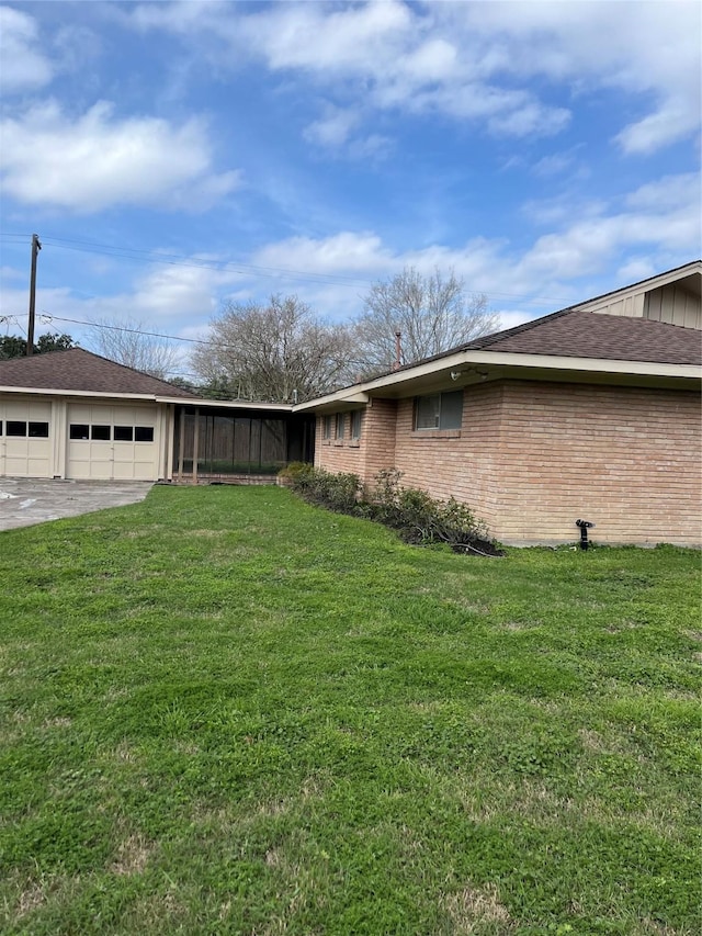 view of yard with a garage