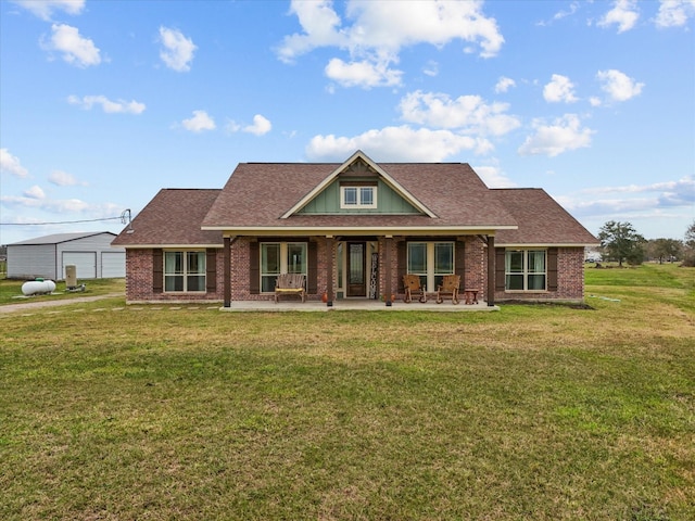 craftsman-style home featuring a front yard, a garage, and a patio area