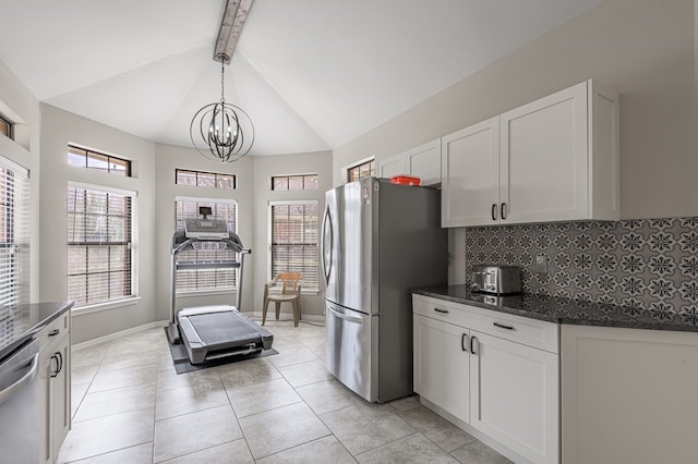 kitchen featuring hanging light fixtures, white cabinetry, and appliances with stainless steel finishes