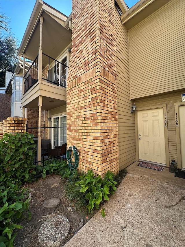 view of home's exterior featuring a balcony