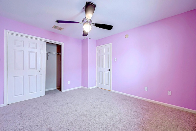 unfurnished bedroom featuring ceiling fan, carpet floors, and a closet